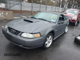 2004 Ford Mustang GT Deluxe z VIN 1FAFP45X74F128442, wystawiony jako IAAI lot #41580930 z przebiegiem 100 801 mil mil oraz . Historia ofert i sprzedaży dostępna na DreamBid. Obrazek 18.