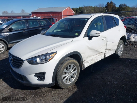 2016 Mazda CX-5 Touring with VIN JM3KE4CYXG0917841, listed as a IAAI auction lot 41420641 with 75,710 mi miles. Bid and sale history available at carsss.com. Image 17.
