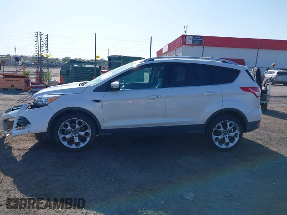 2013 Ford Escape Titanium with VIN 1FMCU0J97DUA70393, listed as a IAAI auction lot 41974106 with 73,548 mi miles and . Bid and sale history available at carsss.com. Image 14.