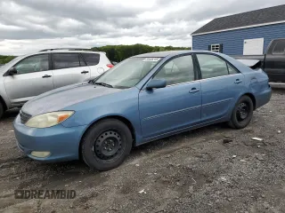 2004 Toyota Camry LE z VIN 4T1BE30K94U892207, wystawiony jako Copart lot #58406245 z przebiegiem 318 751 mil mil oraz Czysty tytuł • Clean title. Historia ofert i sprzedaży dostępna na DreamBid. Obrazek 1.