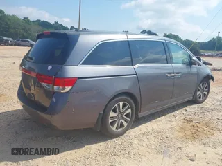 2015 Honda Odyssey Touring Elite with VIN 5FNRL5H95FB127156, listed as a IAAI auction lot 42618059 with 160,074 mi miles and . Bid and sale history available at DreamBid. Image 4.