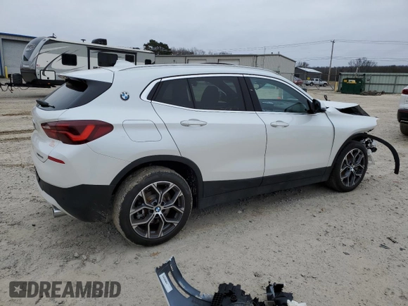 2023 BMW X2 sDrive28i with VIN WBXYH9C07P5V63719, listed as a Copart auction lot 87309194 with 43,124 mi miles and Salvage Title. Bid and sale history available at carsss.com. Image 3.
