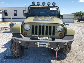 2013 Jeep Wrangler Unlimited Rubicon with VIN 1C4BJWFG0DL587057, listed as a Copart auction lot 57362535 with 102,684 mi miles and Salvage title. Bid and sale history available at DreamBid. Image 5.