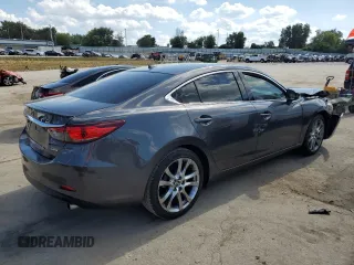 2014 Mazda 6 i Grand Touring с VIN JM1GJ1W67E1135264, выставлен на аукционе Copart как лот 70587624 с пробегом 86 926 миль миль и Списание • Salvage title. История ставок и продаж доступна на DreamBid. Изображение 3.