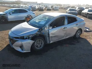 2021 Toyota Prius Prime LE with VIN JTDKAMFP1M3178179, listed as a IAAI auction lot 41233411 with 83,035 mi miles. Bid and sale history available at carsss.com. Image 2.