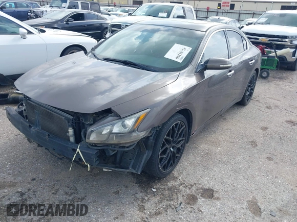 2014 Nissan Maxima SV with VIN 1N4AA5AP2EC447824, listed as a IAAI auction lot 42481206 with 157,540 mi miles and . Bid and sale history available at DreamBid. Image 2.