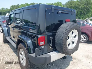 2014 Jeep Wrangler Unlimited Sahara with VIN 1C4BJWEG0EL273086, listed as a IAAI auction lot 42340938 with 121,448 mi miles and . Bid and sale history available at DreamBid. Image 3.
