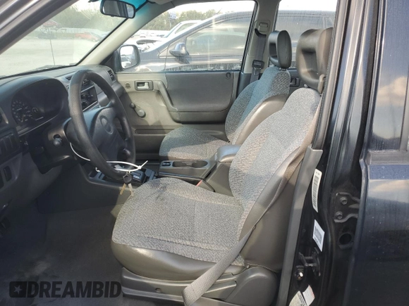 1999 Isuzu Rodeo S with VIN 4S2CK58W7X4357230, listed as a Copart auction lot 85214894 with 130,370 mi miles and Salvage title. Bid and sale history available at DreamBid. Image 7.
