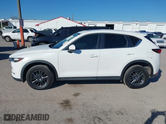 2020 Mazda CX-5 Touring with VIN JM3KFACM6L0737727, listed as a IAAI auction lot 41283200 with 85,949 mi miles and . Bid and sale history available at carsss.com. Image 14.