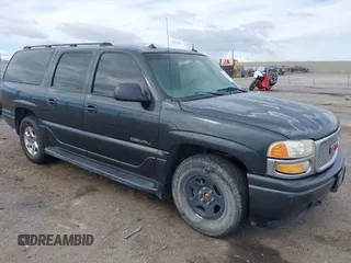 2003 GMC Yukon XL Denali with VIN 1GKFK66U63J249424, listed as a IAAI auction lot 41919651 with 102,802 mi miles. Bid and sale history available at carsss.com. Image 1.