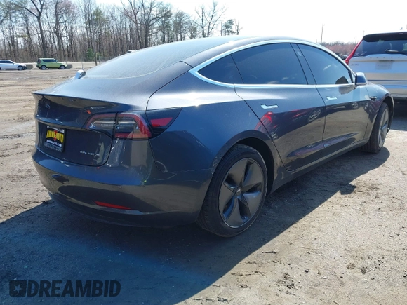 2018 Tesla Model 3 Long Range Battery z VIN 5YJ3E1EB1JF093175, wystawiony jako IAAI lot #41766128 z przebiegiem Nie podano mil oraz . Historia ofert i sprzedaży dostępna na DreamBid. Obrazek 4.