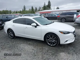 2017 Mazda 6 Grand Touring with VIN JM1GL1X51H1142473, listed as a IAAI auction lot 42234809 with 101,633 mi miles and . Bid and sale history available at DreamBid. Image 14.