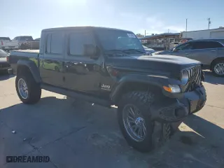 2023 Jeep Gladiator Overland with VIN 1C6HJTFG2PL559314, listed as a Copart auction lot 87530945 with 9,434 mi miles and Salvage Title. Bid and sale history available at carsss.com. Image 4.