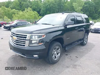 2017 Chevrolet Tahoe LT z VIN 1GNSKBKC8HR311969, wystawiony jako IAAI lot #42126414 z przebiegiem 160 994 mil mil oraz . Historia ofert i sprzedaży dostępna na DreamBid. Obrazek 2.