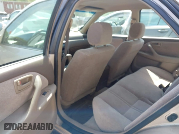 1997 Toyota Camry LE z VIN 4T1BG22K3VU808174, wystawiony jako IAAI lot #42237077 z przebiegiem 100 049 mil mil oraz . Historia ofert i sprzedaży dostępna na DreamBid. Obrazek 8.