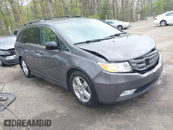 2013 Honda Odyssey Touring with VIN 5FNRL5H94DB013310, listed as a IAAI auction lot 42079565 with 128,622 mi miles and . Bid and sale history available at carsss.com. Image 1.