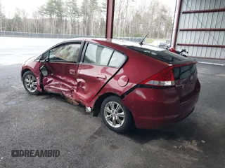 2010 Honda Insight EX with VIN JHMZE2H74AS033674, listed as a IAAI auction lot 41953858 with 144,018 mi miles and . Bid and sale history available at DreamBid. Image 3.