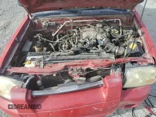 2003 Nissan Frontier XE with VIN 1N6ED27T73C420215, listed as a Copart auction lot 82923734 with 193,468 mi miles and Salvage title. Bid and sale history available at DreamBid. Image 12.