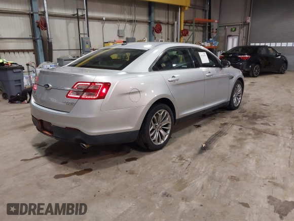 2013 Ford Taurus Limited with VIN 1FAHP2F83DG116657, listed as a IAAI auction lot 41533075 with 124,649 mi miles. Bid and sale history available at carsss.com. Image 4.