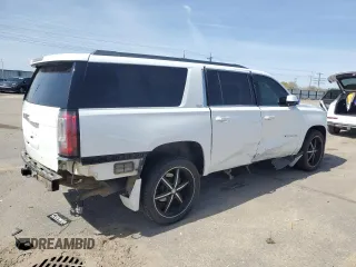 2016 GMC Yukon XL SLT with VIN 1GKS2GKC6GR228033, listed as a Copart auction lot 52450055 with 135,476 mi miles and Salvage Title. Bid and sale history available at DreamBid. Image 3.