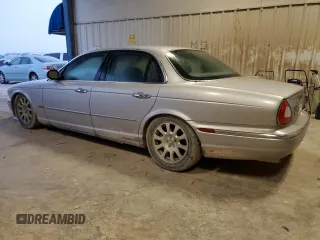 2004 Jaguar XJ with VIN SAJEA71C84SG07220, listed as a Copart auction lot 70916164 with 151,102 mi miles and Salvage Title. Bid and sale history available at carsss.com. Image 2.