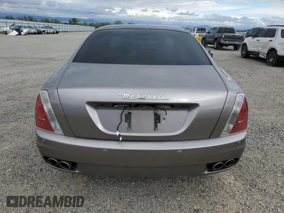 2005 Maserati Quattroporte z VIN ZAMCE39A050017377, wystawiony jako Copart lot #50191415 z przebiegiem 39 545 mil mil oraz Czysty tytuł • Clean title. Historia ofert i sprzedaży dostępna na DreamBid. Obrazek 6.