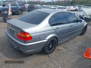 2003 BMW 3 Series 330i with VIN WBAEV53463KM04252, listed as a IAAI auction lot 42006945 with 193,387 mi miles. Bid and sale history available at carsss.com. Image 4.