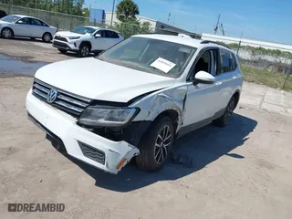 2021 Volkswagen Tiguan SE with VIN 3VV2B7AX4MM031490, listed as a IAAI auction lot 41829654 with 55,739 mi miles. Bid and sale history available at carsss.com. Image 2.