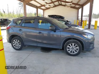 2016 Mazda CX-5 Sport with VIN JM3KE4BY1G0910102, listed as a IAAI auction lot 42115163 with 144,495 mi miles and . Bid and sale history available at carsss.com. Image 14.