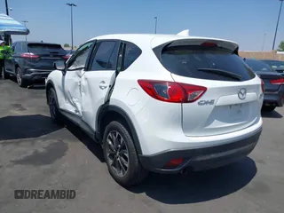 2016 Mazda CX-5 Grand Touring z VIN JM3KE2DY2G0824802, wystawiony jako IAAI lot #42170591 z przebiegiem 53 173 mil mil oraz . Historia ofert i sprzedaży dostępna na DreamBid. Obrazek 14.