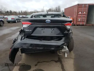 2023 Toyota Corolla Hybrid LE with VIN JTDBDMHE2P3002183, listed as a Copart auction lot 50292785 with 7,065 mi miles and Salvage Title. Bid and sale history available at carsss.com. Image 6.