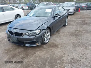 2015 BMW 4 Series 428i xDrive z VIN WBA4A7C5XFD415131, wystawiony jako IAAI lot #42100618 z przebiegiem 89 093 mil mil oraz . Historia ofert i sprzedaży dostępna na DreamBid. Obrazek 17.