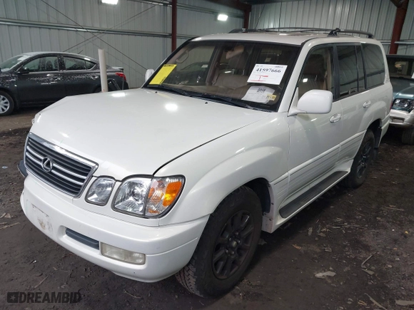 1999 Lexus LX 470 Luxury SUV with VIN JT6HT00W1X0056660, listed as a IAAI auction lot 41597666 with 242,362 mi miles. Bid and sale history available at carsss.com. Image 17.