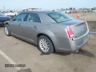 2014 Chrysler 300 with VIN 2C3CCAAG3EH322855, listed as a IAAI auction lot 42053129 with 172,687 mi miles. Bid and sale history available at carsss.com. Image 3.