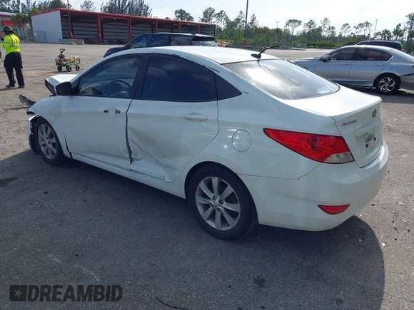 2014 Hyundai Accent GLS with VIN KMHCU4AE8EU608539, listed as a IAAI auction lot 41946784 with 106,709 mi miles and . Bid and sale history available at carsss.com. Image 3.
