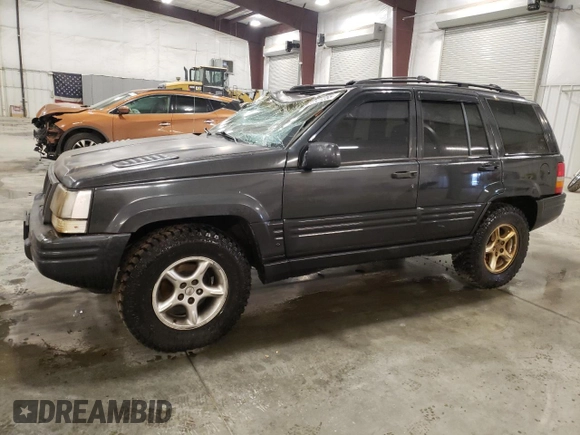 1998 Jeep Grand Cherokee Limited with VIN 1J4GZ88Z3WC165659, listed as a Copart auction lot 87527255 with 203,860 mi miles and Salvage Title. Bid and sale history available at carsss.com. Image 1.