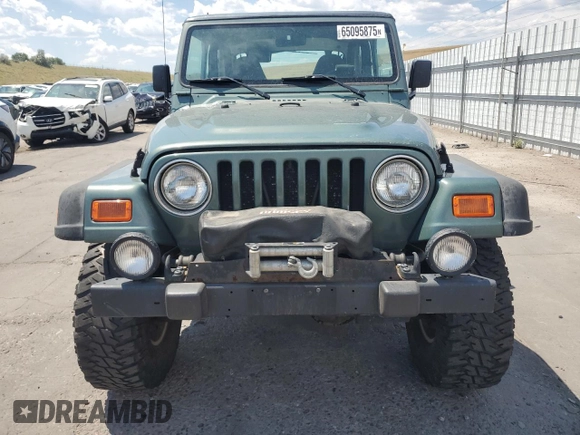 2000 Jeep Wrangler Sport с VIN 1J4FA49S4YP710633, выставлен на аукционе Copart как лот 65095875 с пробегом 107 613 миль миль и Чистый • Clean title. История ставок и продаж доступна на DreamBid. Изображение 5.