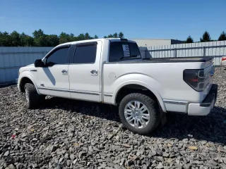 2013 Ford F-150 XLT with VIN 1FTFW1E65DFA84587, listed as a Copart auction lot 69295264 with 216,967 mi miles and Salvage Title. Bid and sale history available at carsss.com. Image 2.