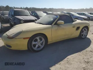1998 Porsche Boxster z VIN WP0CA2982WU623104, wystawiony jako Copart lot #83398714 z przebiegiem Nie podano mil oraz Czysty tytuł • Clean title. Historia ofert i sprzedaży dostępna na DreamBid. Obrazek 1.