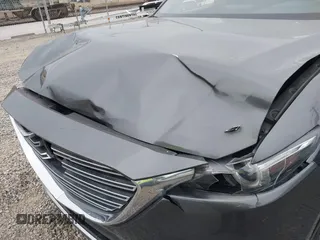 2016 Mazda CX-9 Grand Touring with VIN JM3TCBDY1G0103560, listed as a IAAI auction lot 41344813 with 123,588 mi miles and . Bid and sale history available at DreamBid. Image 17.