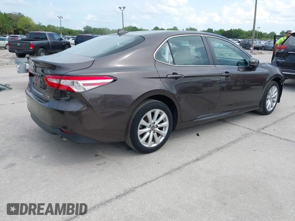 2019 Toyota Camry LE with VIN 4T1B11HKXKU818442, listed as a IAAI auction lot 41906128 with 30,728 mi miles and . Bid and sale history available at DreamBid. Image 4.