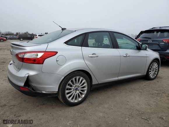 2012 Ford Focus Titanium with VIN 1FAHP3J21CL293447, listed as a Copart auction lot 43963615 with 151,448 mi miles and Salvage Title. Bid and sale history available at carsss.com. Image 3.