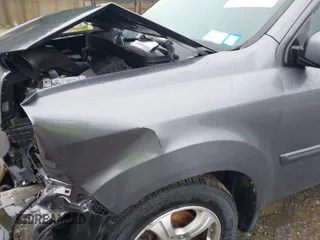 2015 Honda Pilot EX-L with VIN 5FNYF4H51FB064583, listed as a IAAI auction lot 41977746 with 120,398 mi miles and . Bid and sale history available at carsss.com. Image 20.