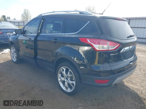 2014 Ford Escape Titanium with VIN 1FMCU9J93EUE27803, listed as a IAAI auction lot 42028249 with 131,194 mi miles and . Bid and sale history available at DreamBid. Image 3.