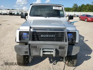 1987 Suzuki Samurai z VIN JS3JC51C3H4186141, wystawiony jako Copart lot #72551804 z przebiegiem 525 030 mil mil oraz Szkody całkowita. Historia ofert i sprzedaży dostępna na DreamBid. Obrazek 5.