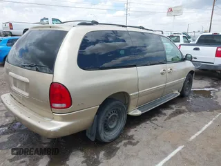 1999 Chrysler Town & Country LXi with VIN 1C4GP54L0XB512495, listed as a IAAI auction lot 39677461 with 284,495 mi miles. Bid and sale history available at carsss.com. Image 4.