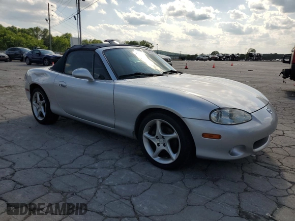 2003 Mazda MX-5 Miata Cloth with VIN JM1NB353230312510, listed as a Copart auction lot 54925895 with 141,391 mi miles and Salvage Title. Bid and sale history available at DreamBid. Image 4.