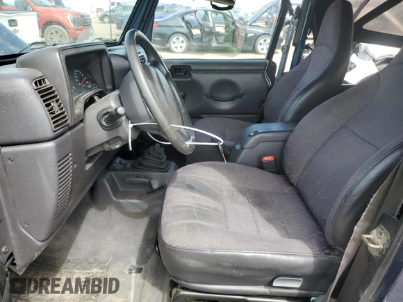 2002 Jeep Wrangler Sport z VIN 1J4FA49SX2P772609, wystawiony jako Copart lot #55893425 z przebiegiem 157 653 mil mil oraz Szkoda całkowita • Salvage title. Historia ofert i sprzedaży dostępna na DreamBid. Obrazek 7.