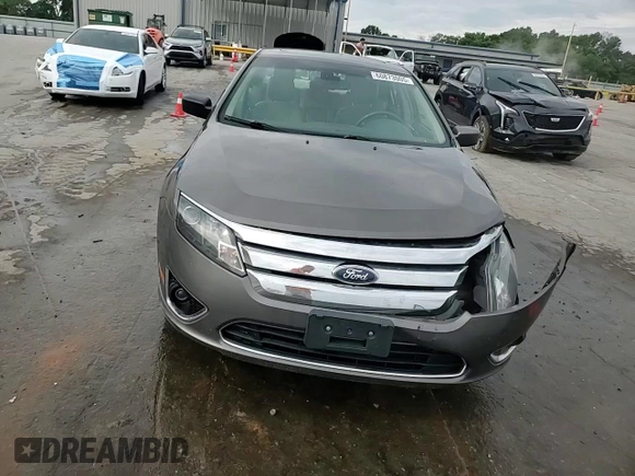 2012 Ford Fusion Hybrid z VIN 3FADP0L33CR211609, wystawiony jako Copart lot #60873005 z przebiegiem 144 474 mil mil oraz Szkoda całkowita • Salvage title. Historia ofert i sprzedaży dostępna na DreamBid. Obrazek 14.