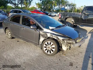 2010 Honda Civic Sdn EX with VIN 19XFA1F80AE026715, listed as a IAAI auction lot 41887154 with 128,272 mi miles. Bid and sale history available at carsss.com. Image 1.